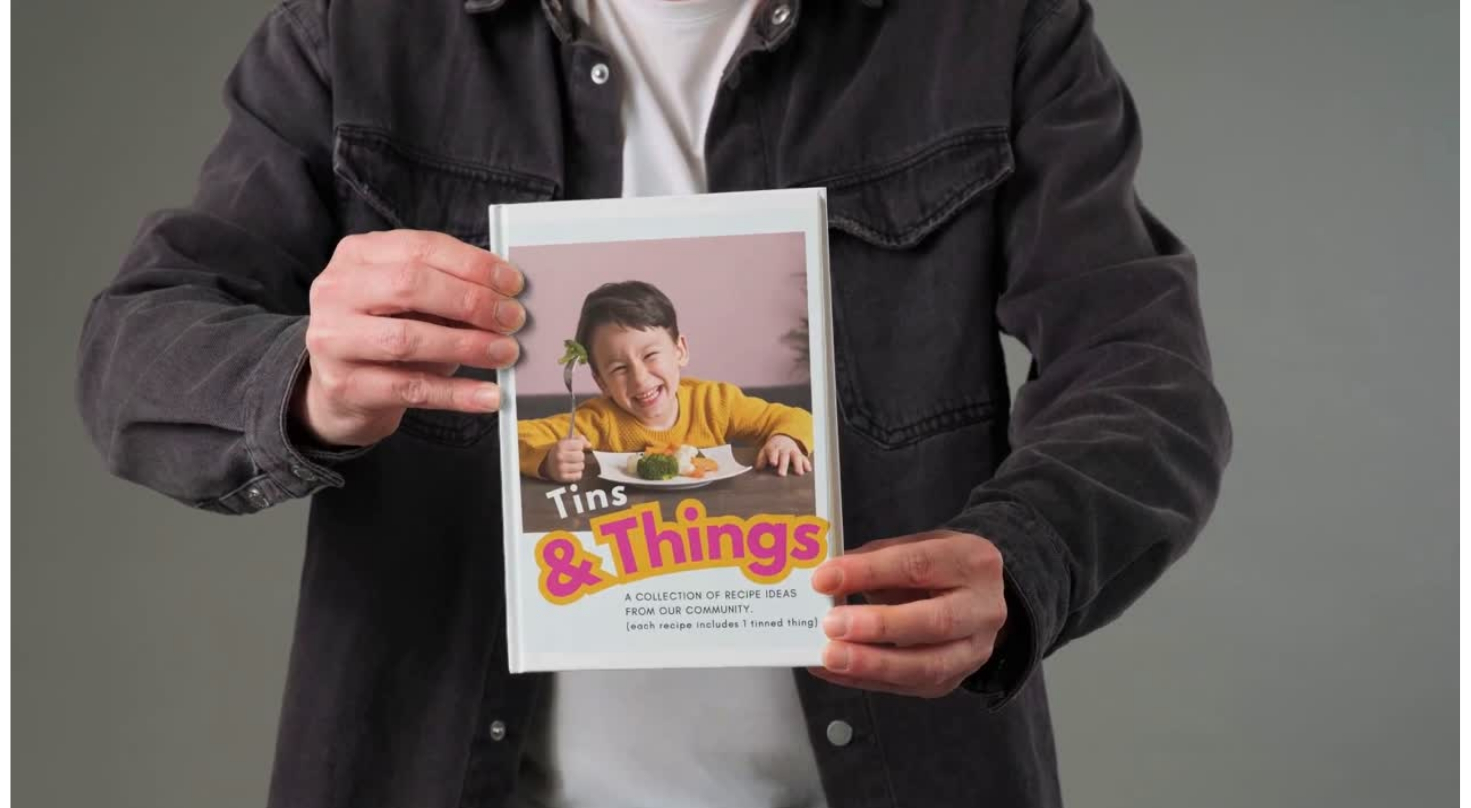 mock up of a new recipe book cover, held by man